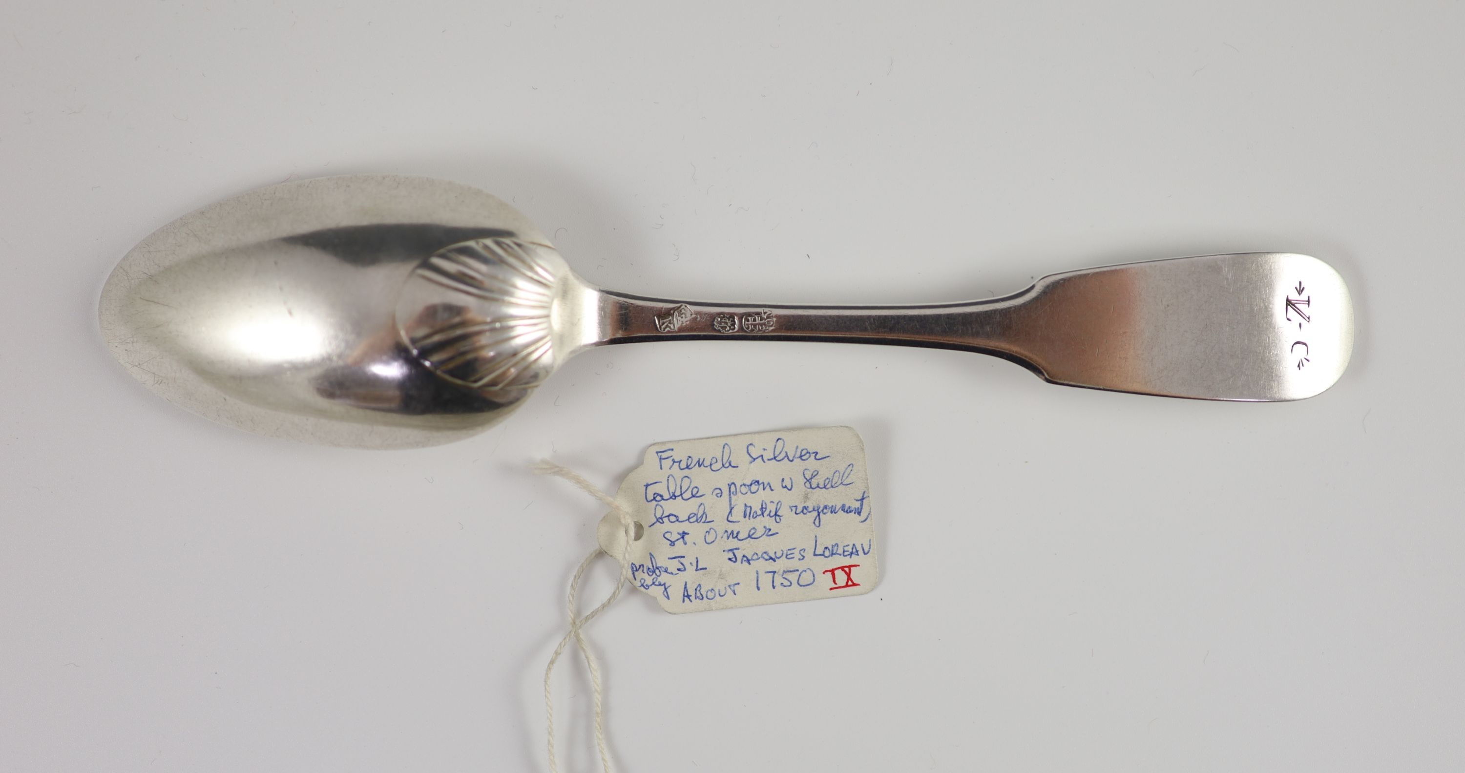 An 18th century French silver fiddle pattern tablespoon, 20cm long, 2.6 oz.